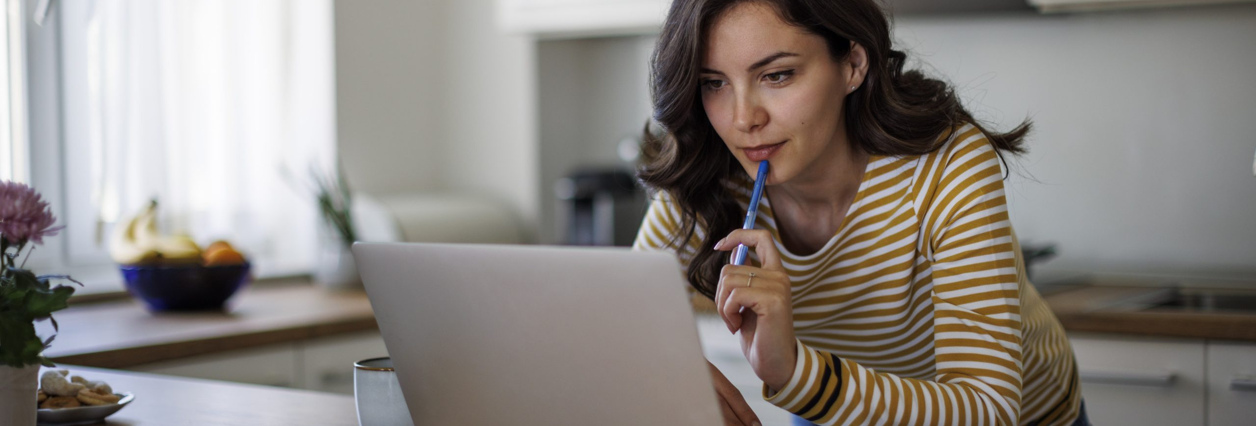 Young woman using a laptop while working from home